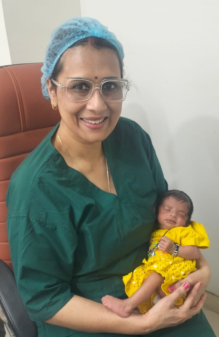 Dr. Archana Bharti IVF specialist holding newborn baby